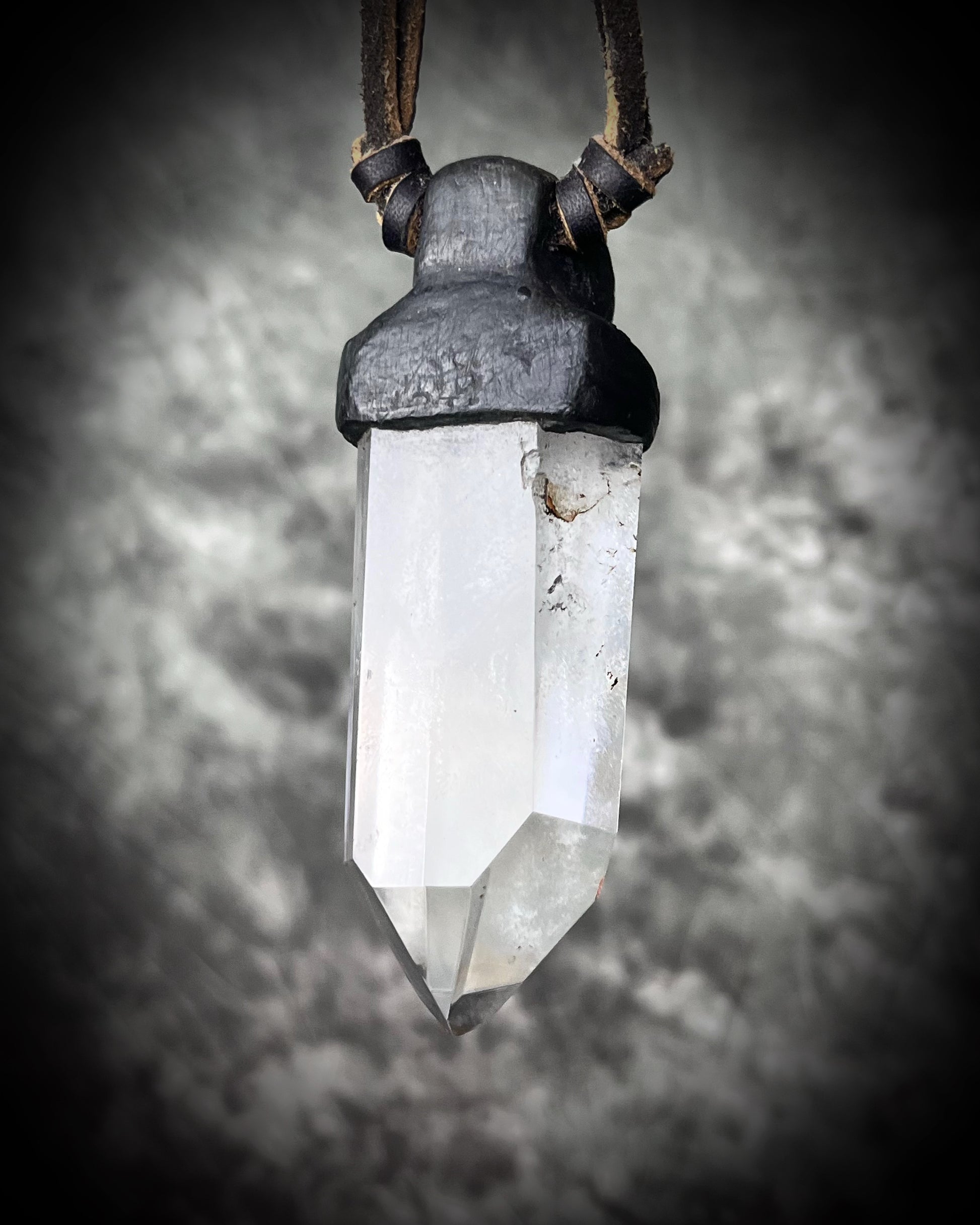 Unisex quartz point and lapis lazuli necklace on leather with a metal hook clasp, handmade in Thailand by artisan Anothai Hansen.