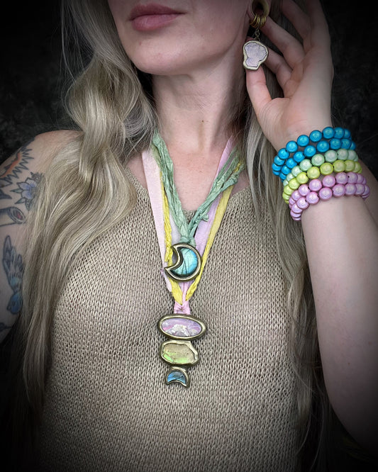 Various handmade colorful gemstone necklaces and beaded bracelets by Become Spellbound. Labradorite moon necklace, celestial jewelry.
