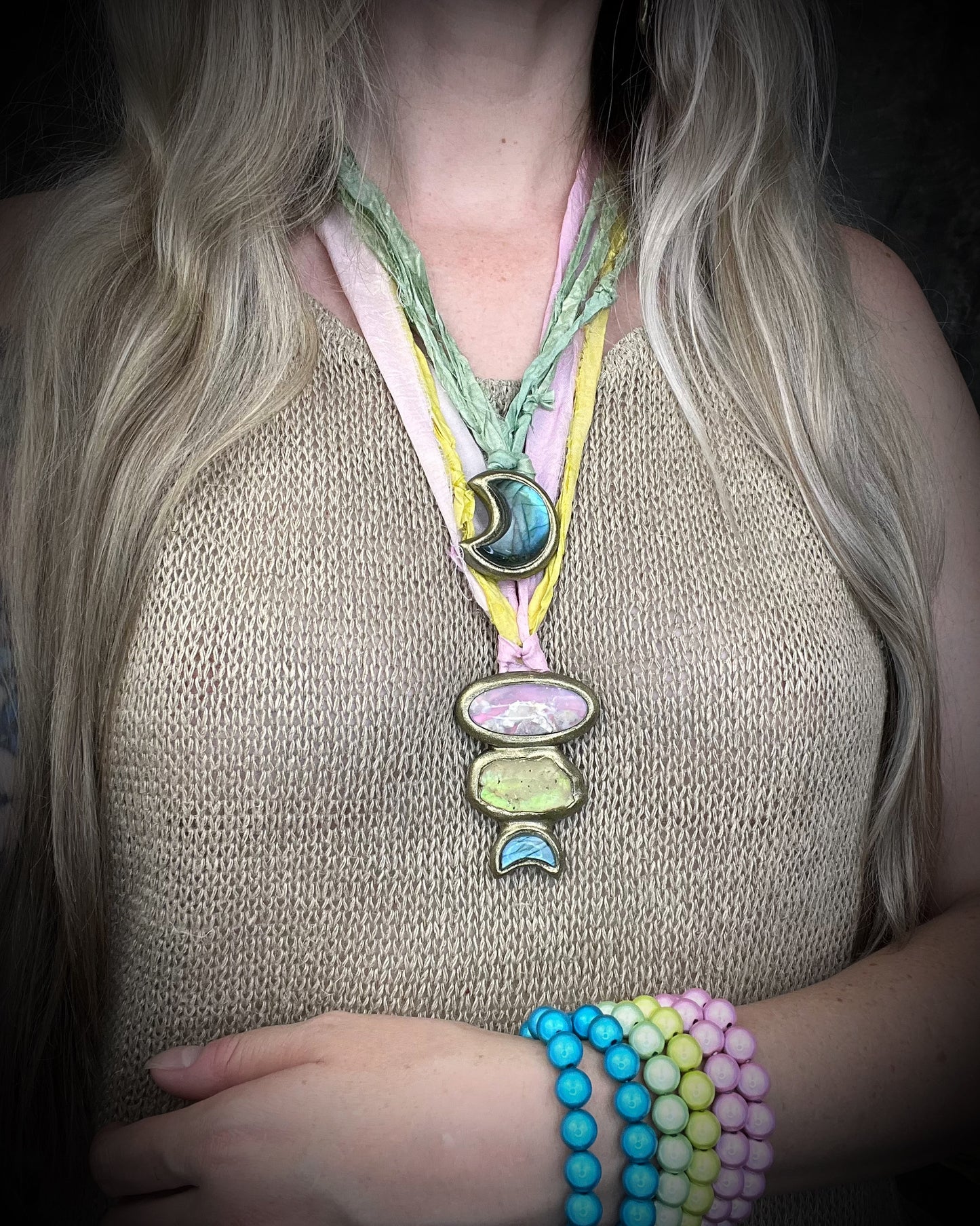 Various handmade colorful gemstone necklaces and beaded bracelets by Become Spellbound. Labradorite moon necklace, celestial jewelry.
