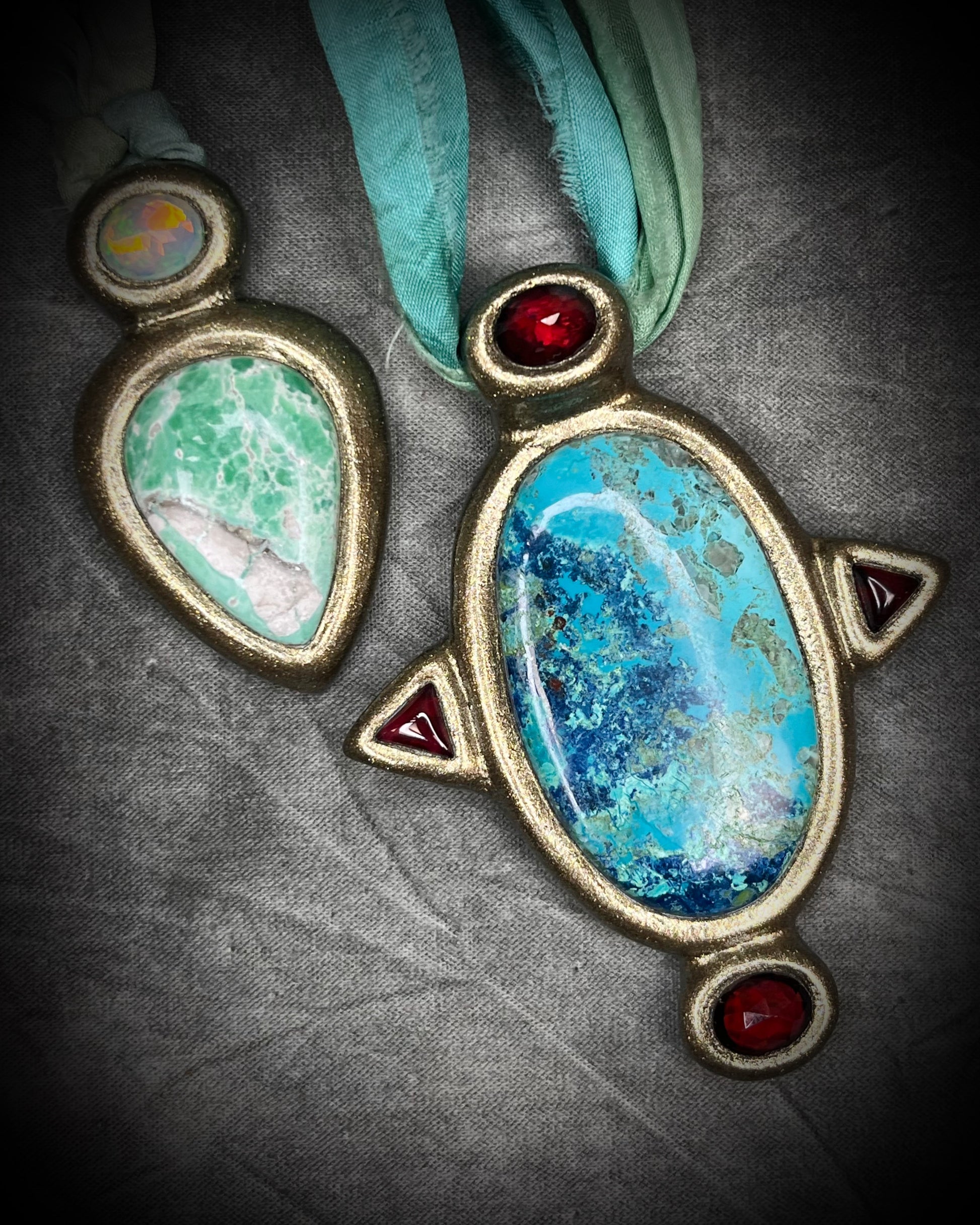 Variscite crystal pendant with green and white stone adorned with a sparkling opal and crafted in a gold frame. Gold necklace hung from soft sea green recycled silk. Boho Spiritual jewelry gift for her. Shown here with The Empress talisman.