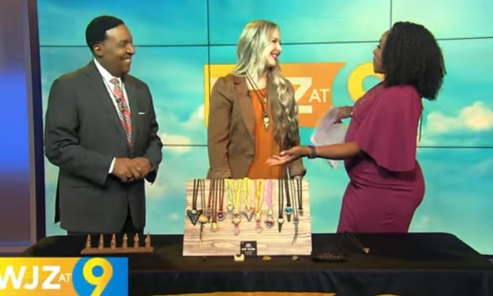 Load video: Kari Dern of Become Spellbound featured on WJZ CBS Baltimore discussing her Best of Baltimore award-winning jewelry, including Libyan Desert Glass, meteorites, tektites, and one-of-a-kind megalodon tooth jewelry.