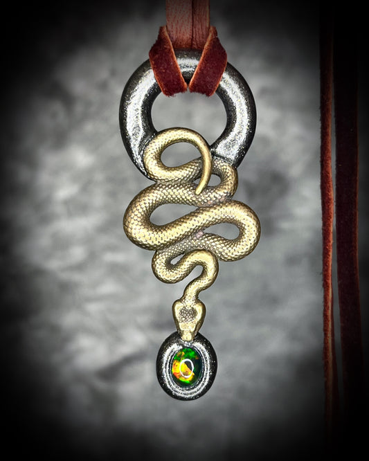 Witchy brass snake necklace with genuine black opal gemstone, spiritual talisman jewelry for empowerment, grounding, and mysticism.