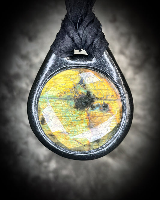 Witchy labradorite necklace on black recycled silk ribbon, hand-sculpted crystal talisman with iridescent gemstone pendant, boho gothic jewelry for modern witches.