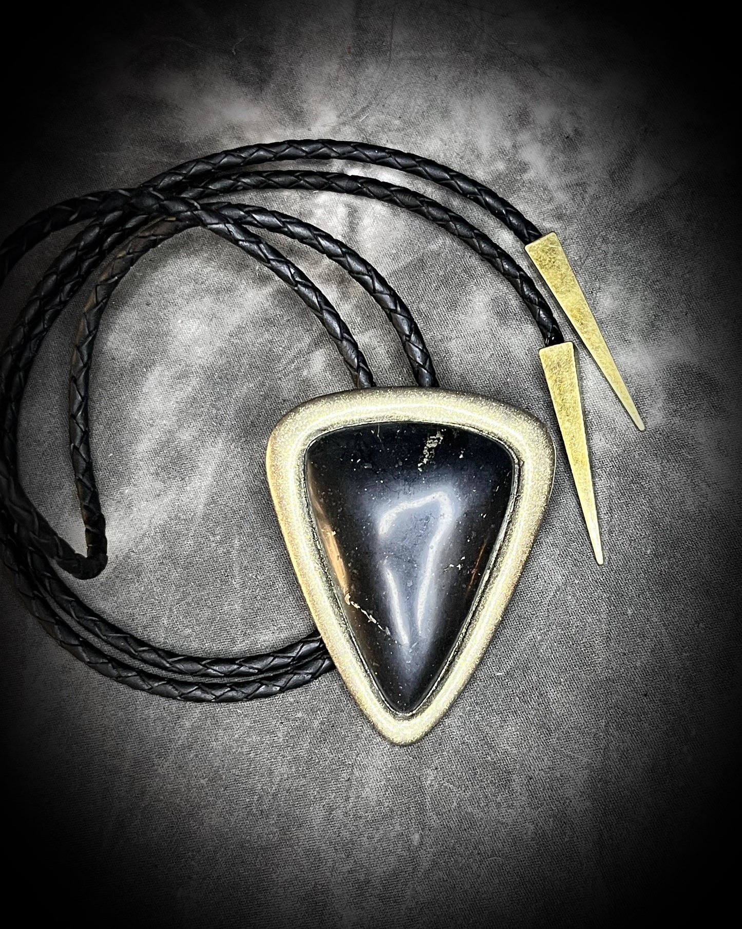 XL Black Tourmaline bolo tie in gold setting on black leather cord