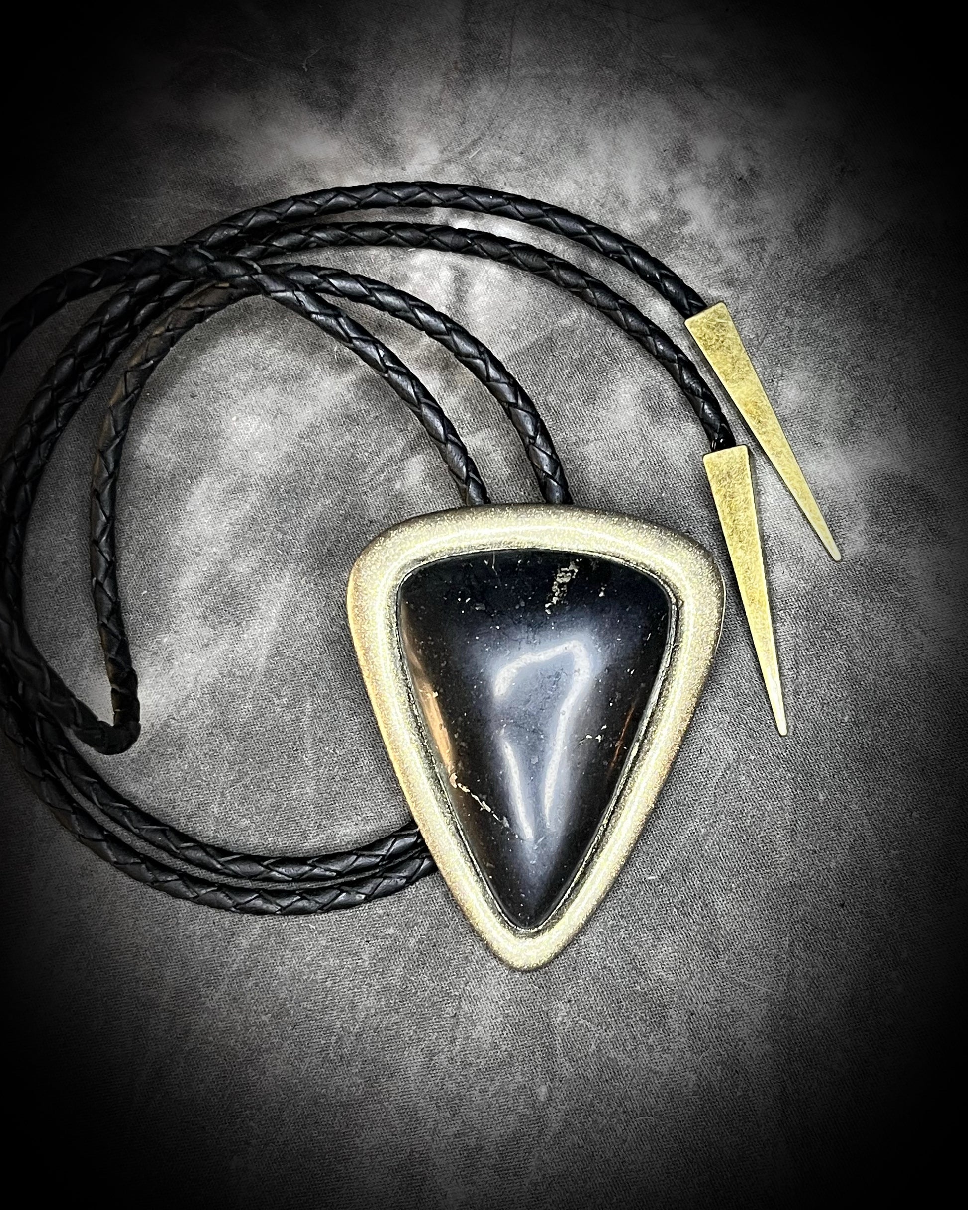 XL Black Tourmaline bolo tie in gold setting on black leather cord