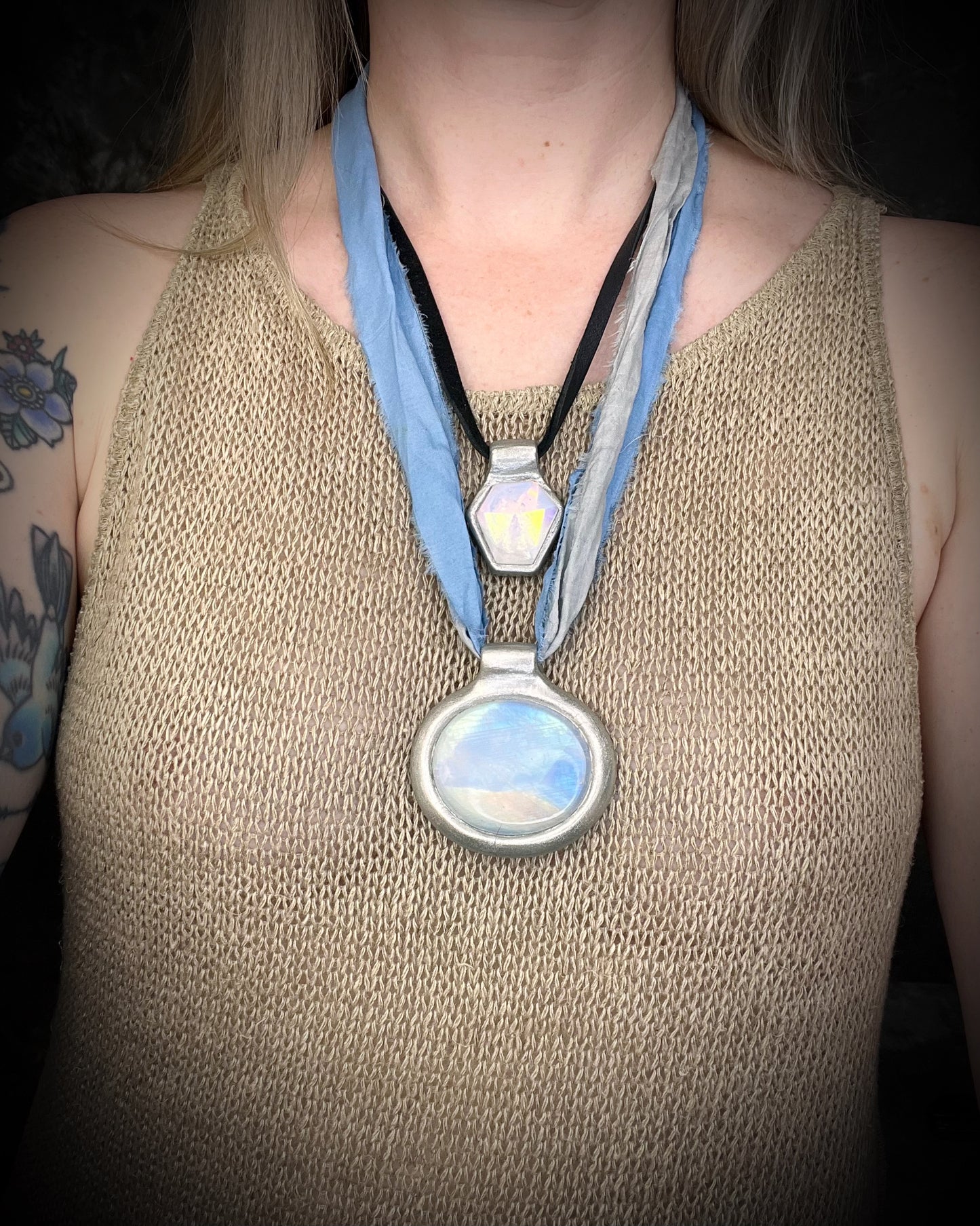 XL rainbow moonstone fire pendant handmade in a silver finish for moon goddess energy. Hung from blue and silver recycled silk for an ethereal and intuitive energy. Spiritual summer jewelry gift for her. 