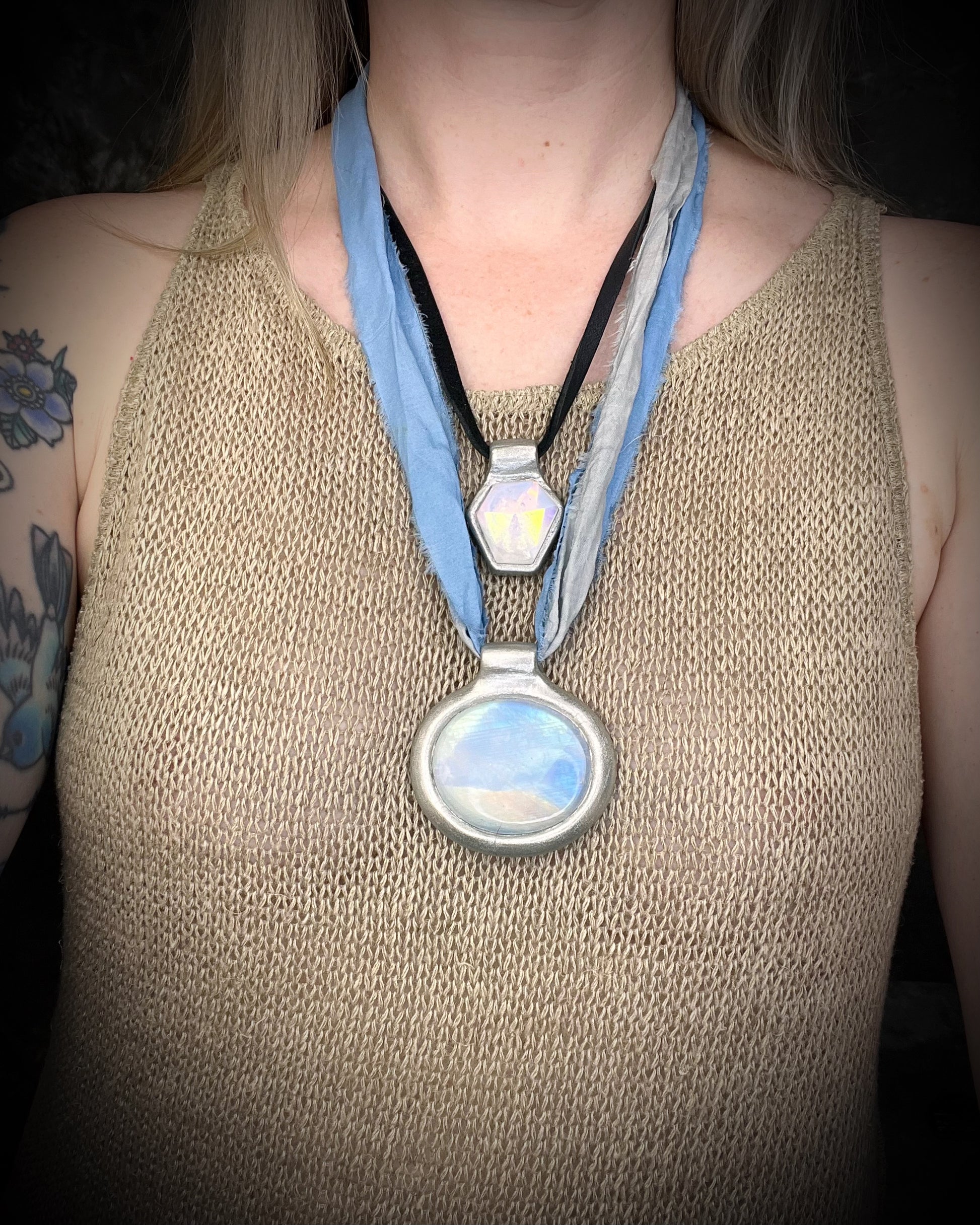 XL rainbow moonstone fire pendant handmade in a silver finish for moon goddess energy. Hung from blue and silver recycled silk for an ethereal and intuitive energy. Spiritual summer jewelry gift for her. 