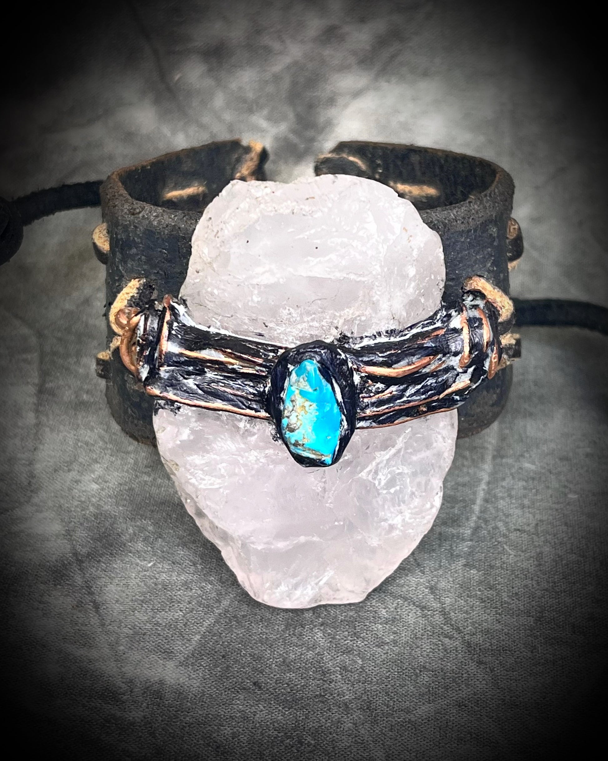  XL stitched leather cuff, handmade with a large raw Rose Quartz crystal paired with a Turquoise accent stone, and a  tie-on leather cord closure for an adjustable, unisex fit.