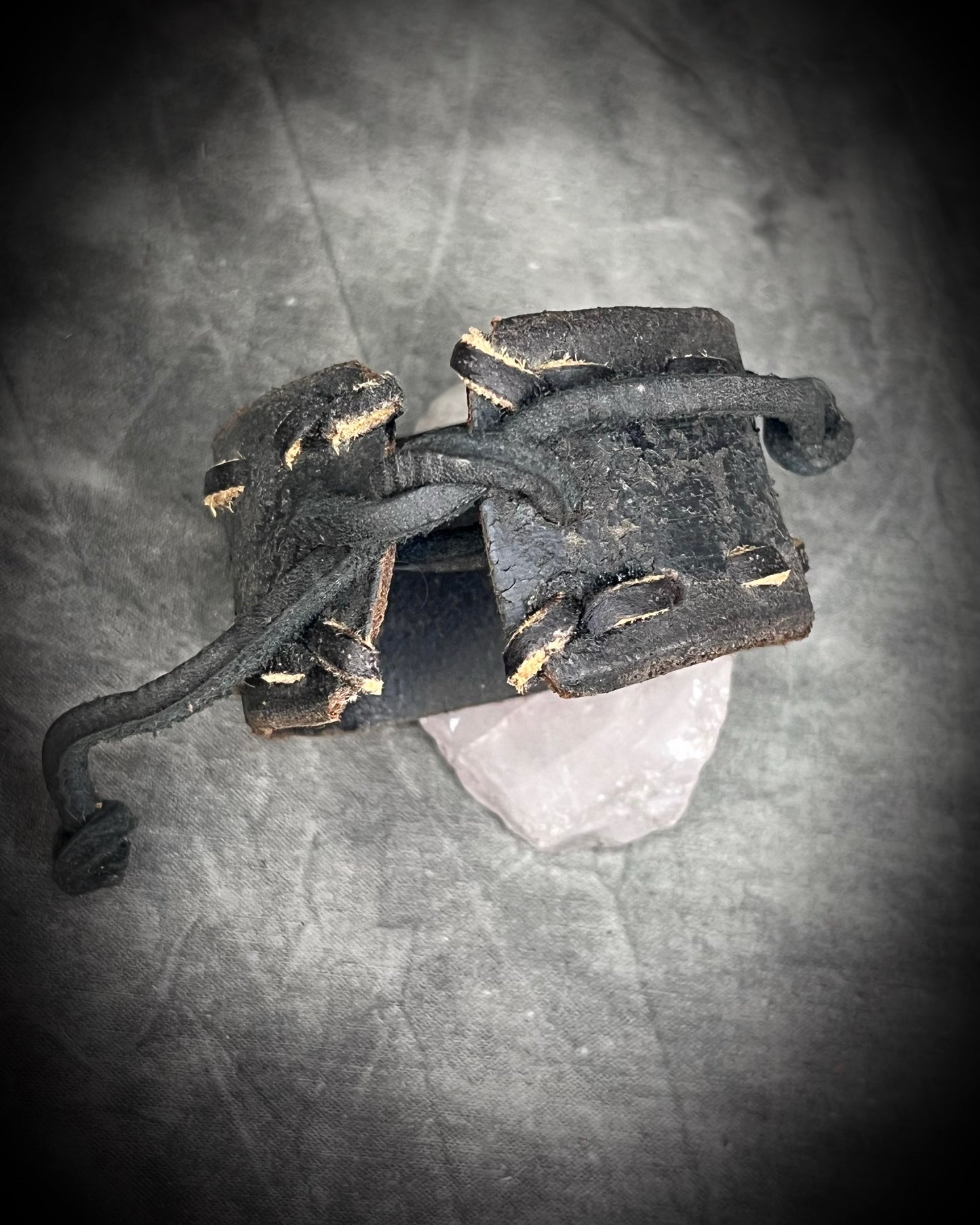  XL stitched leather cuff, handmade with a large raw Rose Quartz crystal paired with a Turquoise accent stone, and a  tie-on leather cord closure for an adjustable, unisex fit.