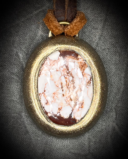 Year of the Horse inspired necklace featuring Wild Horse Magnesite crystal, in a gold setting and hung from earthy brown leather. Talisman for wild hearts and boho western fashion. 