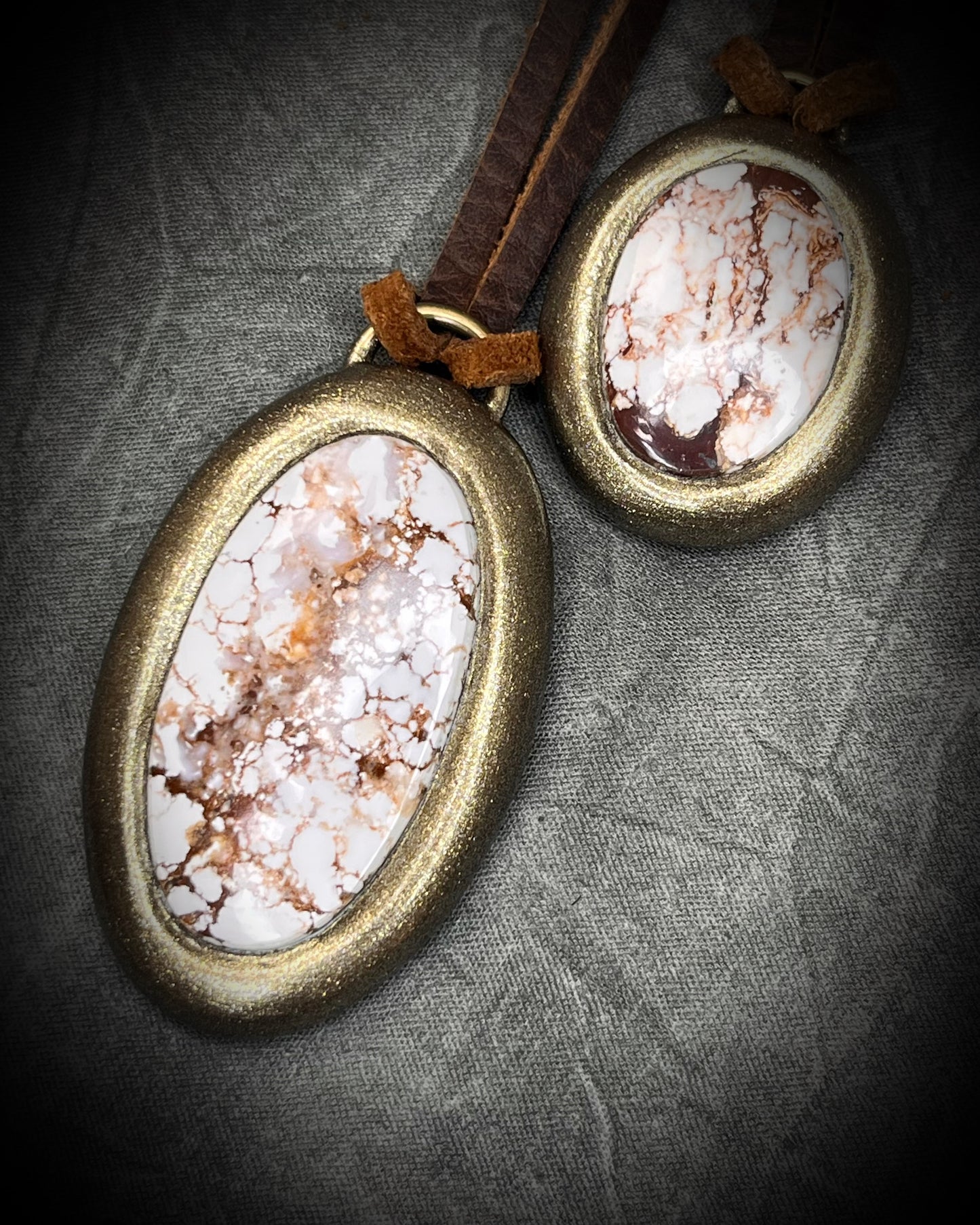 2026 Year of the Horse inspired necklaces featuring Wild Horse Magnesite crystal, both in a gold setting and hung from earthy brown leather. Talismans for wild hearts and boho western fashion. 
