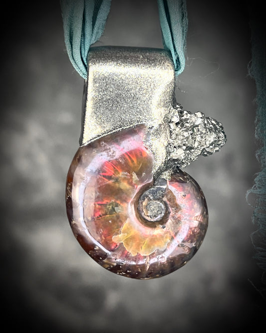 Ammonite fossil pendant adorned with pyrite crystal and hung from aqua recycled silks, handmade jewelry gift for her.