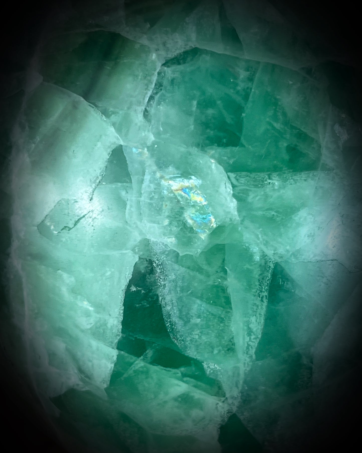 Close-up of green crystal skull with intricate patterns and included rainbow! new year manifestation magic or holiday altar gift!