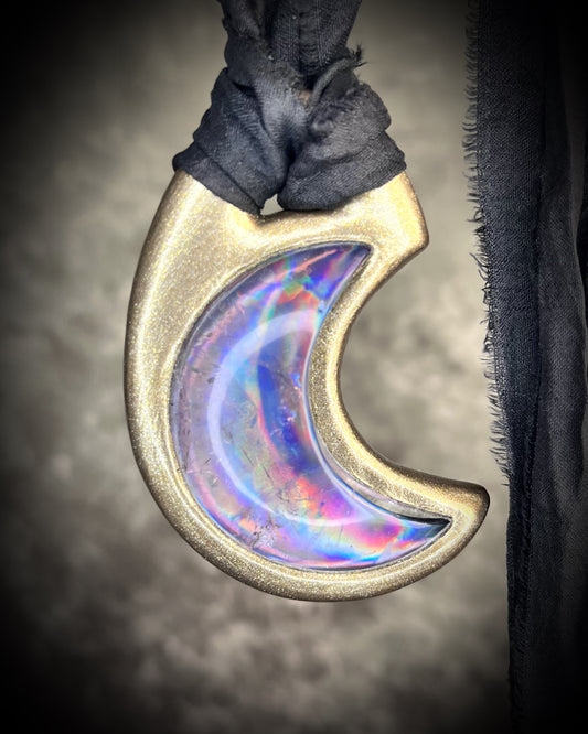 Metallic gold crescent moon pendant with iridescent rainbow quartz crystal on black recycled silk