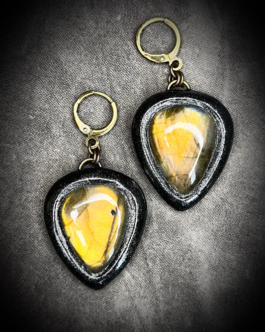 Golden glowing teardrop shaped labradorite gemstone earrings in a black finish on brass hypoallergenic earring hooks. 