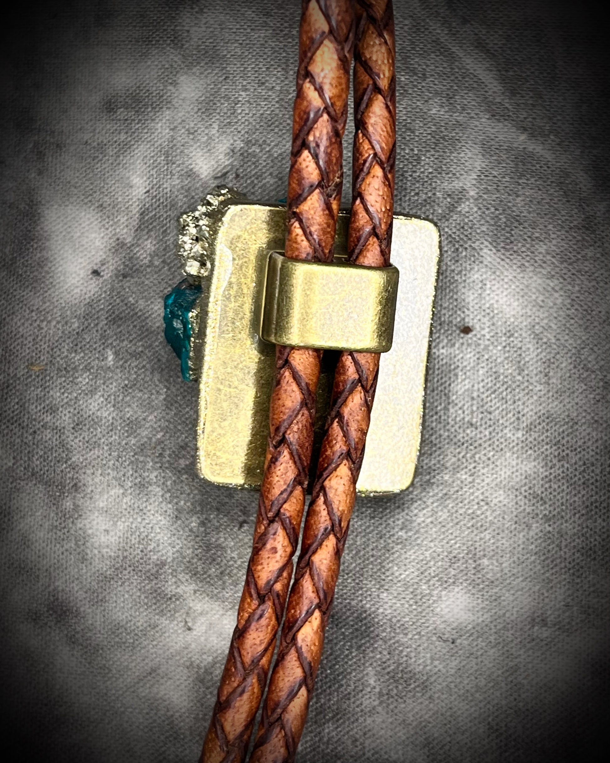 Dioptase and Pyrite bolo tie on brown leather – unique handmade bolo necklace, artisan gemstone bolo tie jewelry, mystical men’s bolo for bold style.