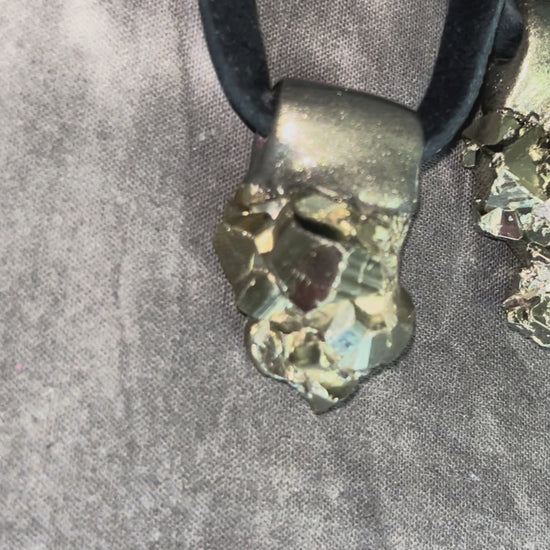 Chunky pyrite pendant necklace on black leather cord, raw crystal talisman jewelry, bold statement necklace with metallic gold healing stone.