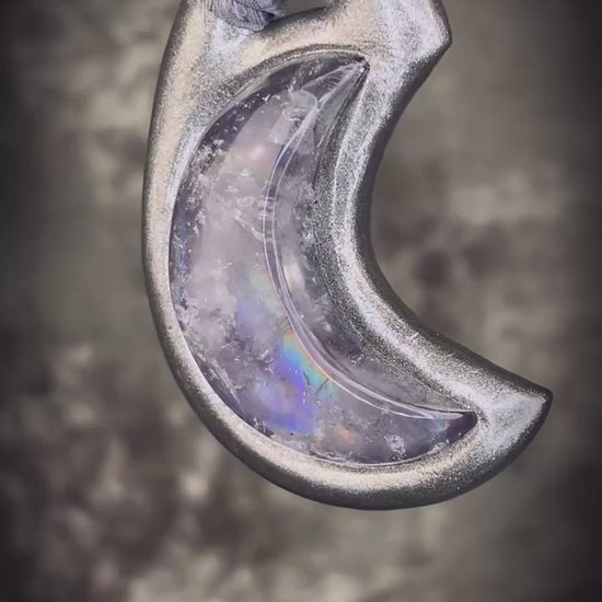 Black rainbow quartz crescent moon talisman on recycled silk with dark iridescent rainbow flashes, handcrafted by Become Spellbound.