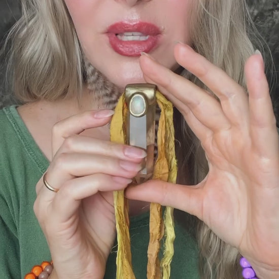 Video showing citrine and opal gemstone necklace on yellow recycled silks, sustainable festival jewelry, summer, eco-friendly handmade jewelry