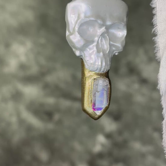 White pearl Skull-shaped pendant with a gold base and clear rainbow crystal on grey recycled silk.  White witch 2025 fall necklace gift for her. 