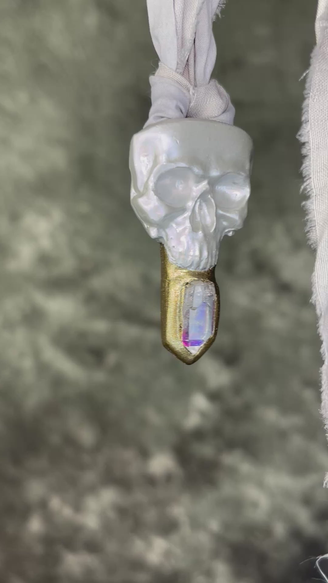 White pearl Skull-shaped pendant with a gold base and clear rainbow crystal on grey recycled silk.  White witch 2025 fall necklace gift for her. 