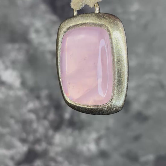 Rose quartz handmade necklace in gold finish on gold shimmering leather. Artisan jewelry made by Baltimore's Best Jeweler  2026 winner Become Spellbound. 