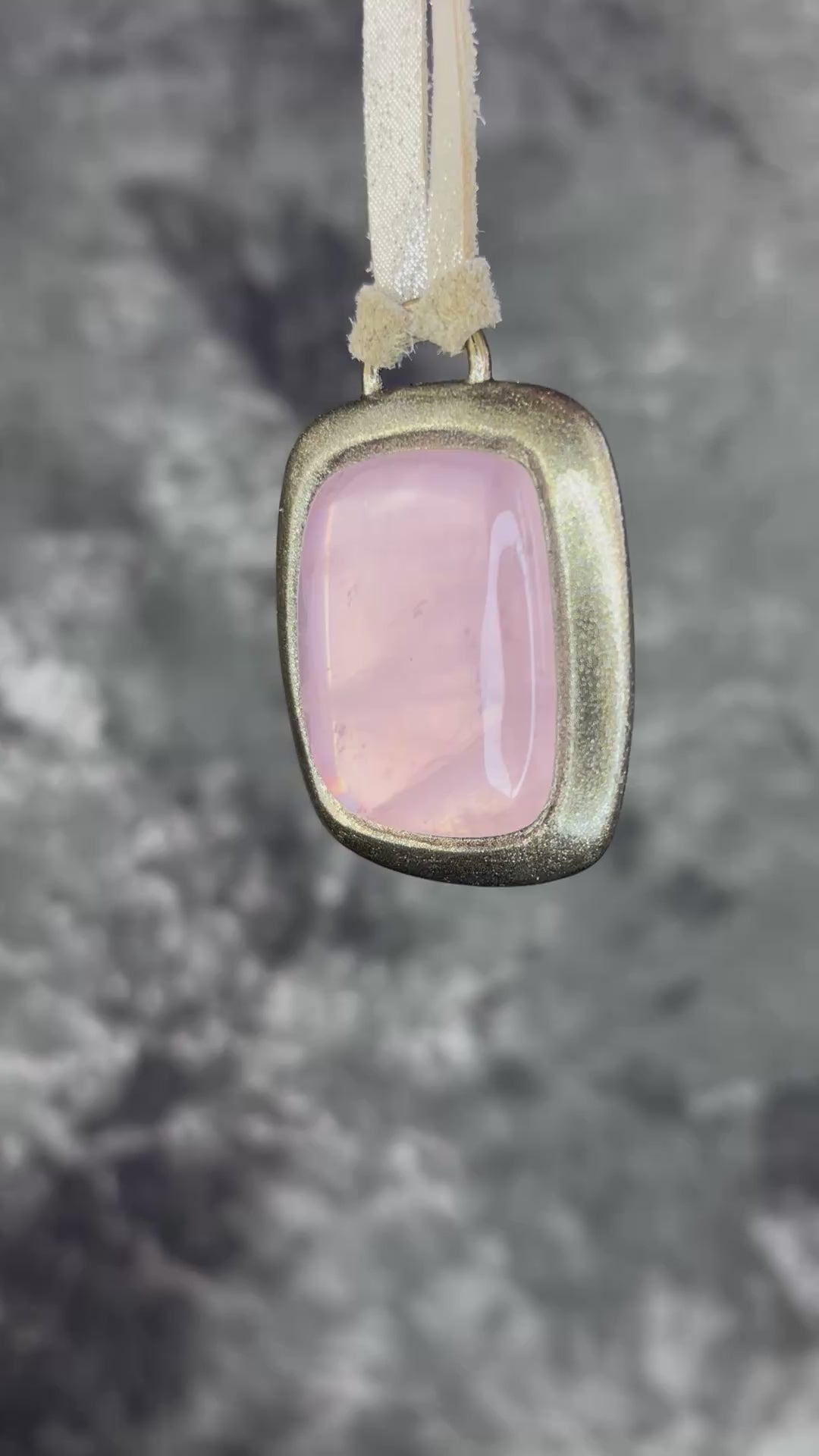 Rose quartz handmade necklace in gold finish on gold shimmering leather. Artisan jewelry made by Baltimore's Best Jeweler  2026 winner Become Spellbound. 