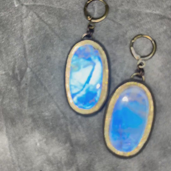 Luminous flashy rainbow moonstone earrings in gold finish hung from hypoallergenic brass huggie earring hooks. Goddess gift for her.