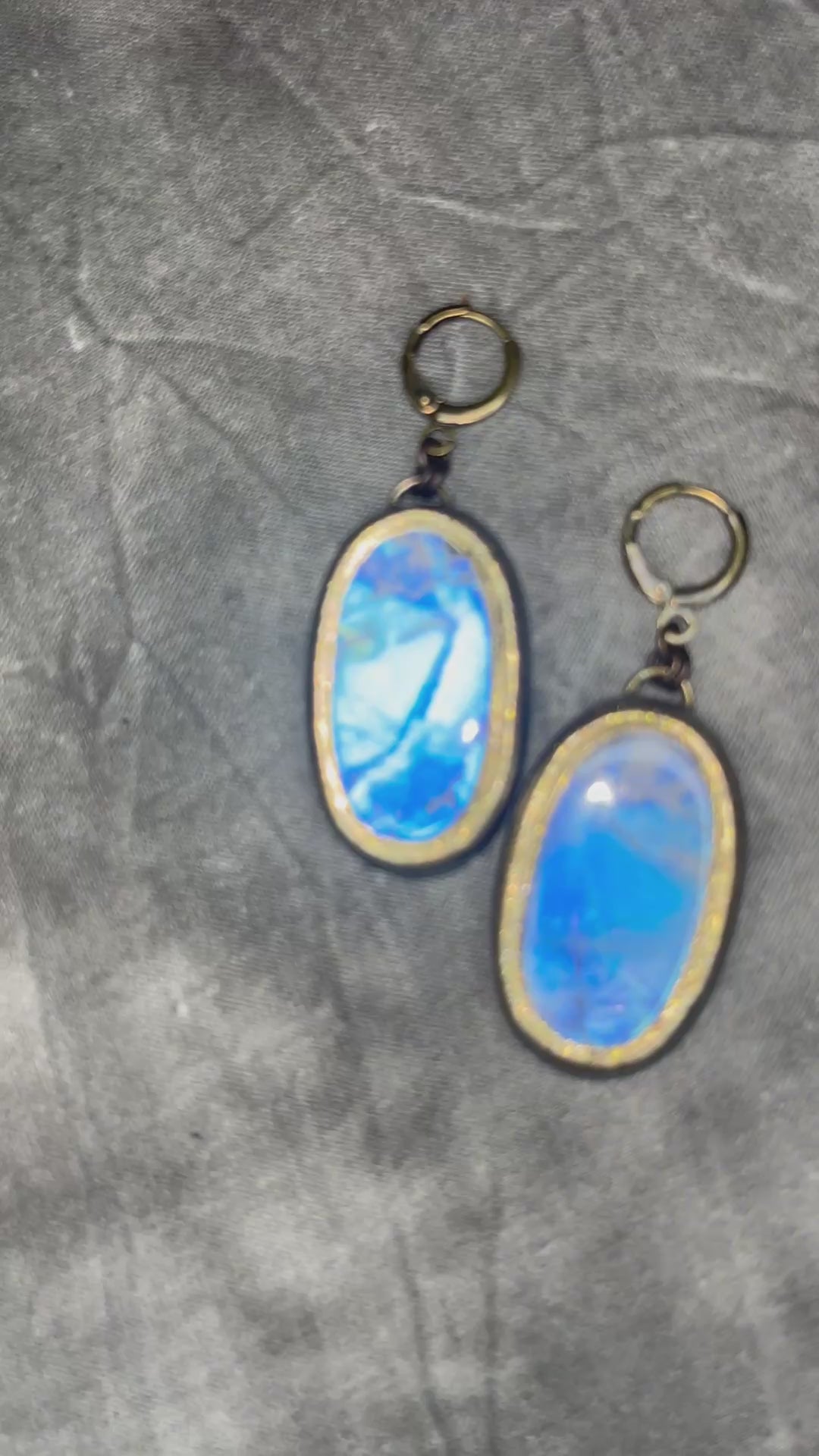 Luminous flashy rainbow moonstone earrings in gold finish hung from hypoallergenic brass huggie earring hooks. Goddess gift for her.