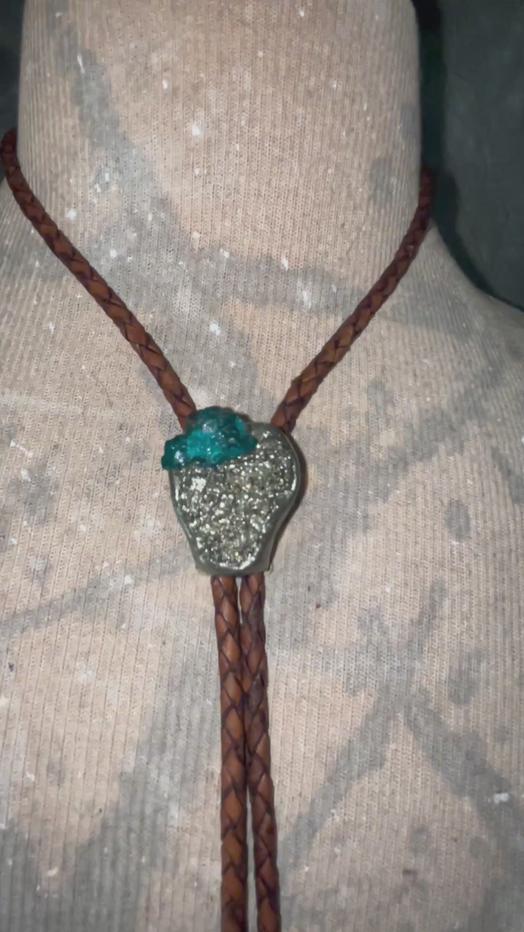 Video of Chunky Pyrite and Dioptase crystal bolo tie on brown leather – unique handmade bolo necklace, artisan gemstone bolo tie jewelry, mystical men’s bolo for bold style.