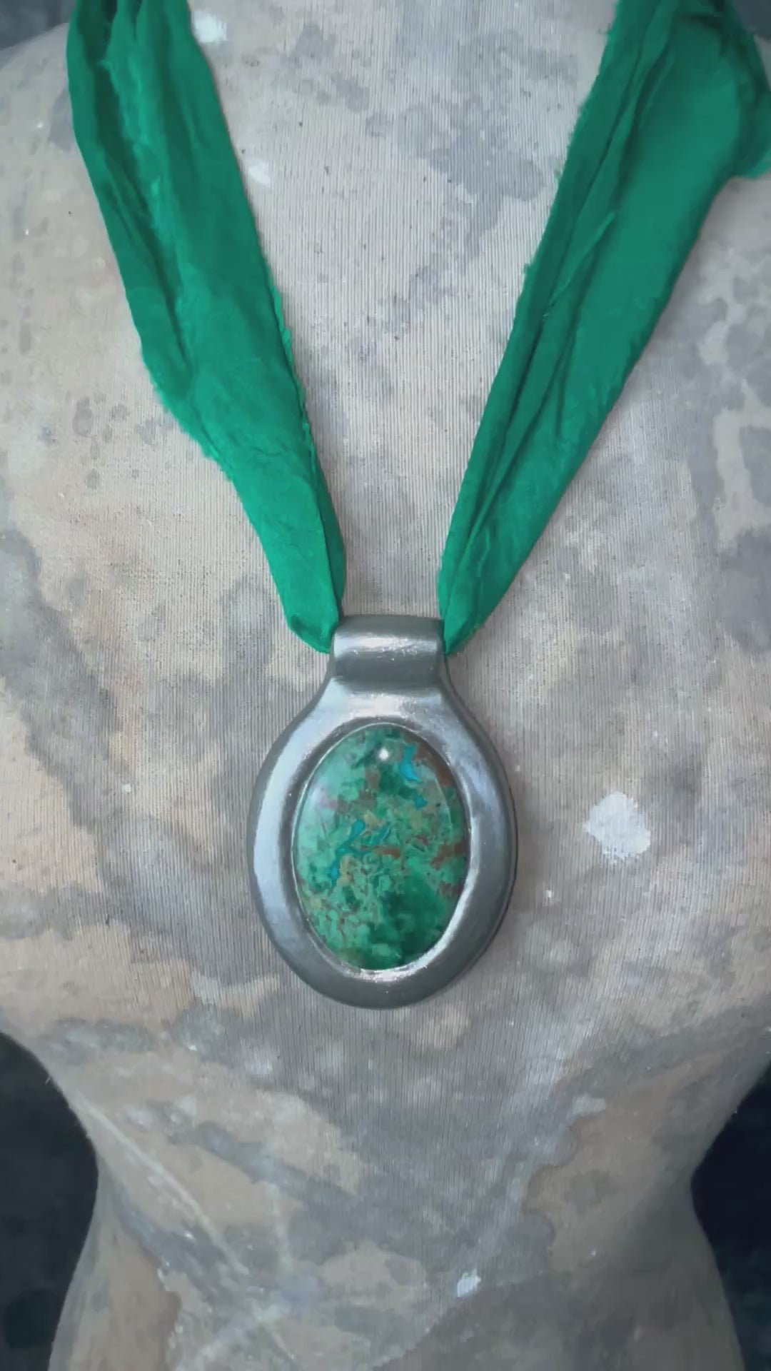 Oval Chrysocolla gemstone pendant in silver finish on emerald green recycled silk cord.