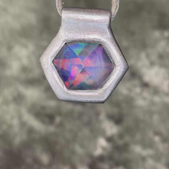 Iridescent aura black rainbow quartz crystal pendant in silver hanging from grey leather, chunky gemstone jewelry gift for her. David Bowie inspired jewelry.  