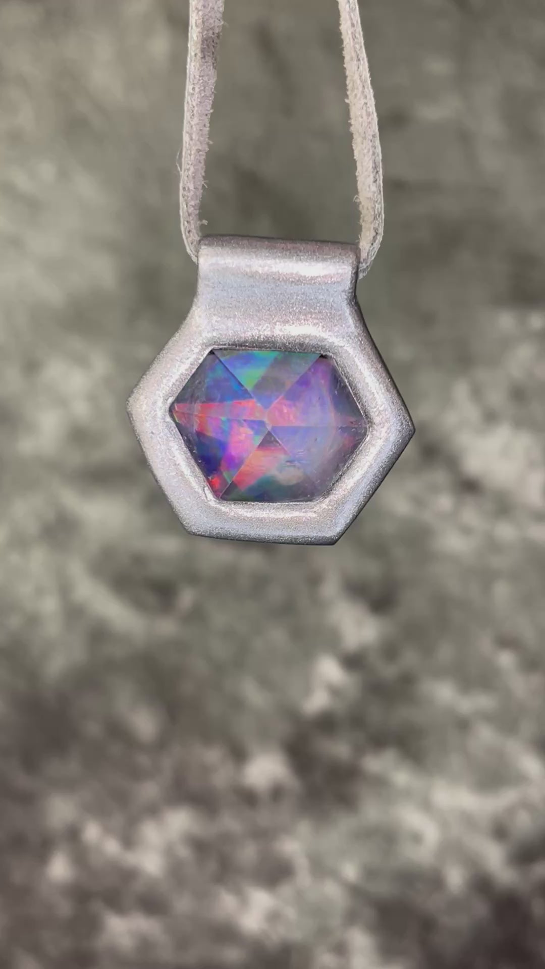 Iridescent aura black rainbow quartz crystal pendant in silver hanging from grey leather, chunky gemstone jewelry gift for her. David Bowie inspired jewelry.  