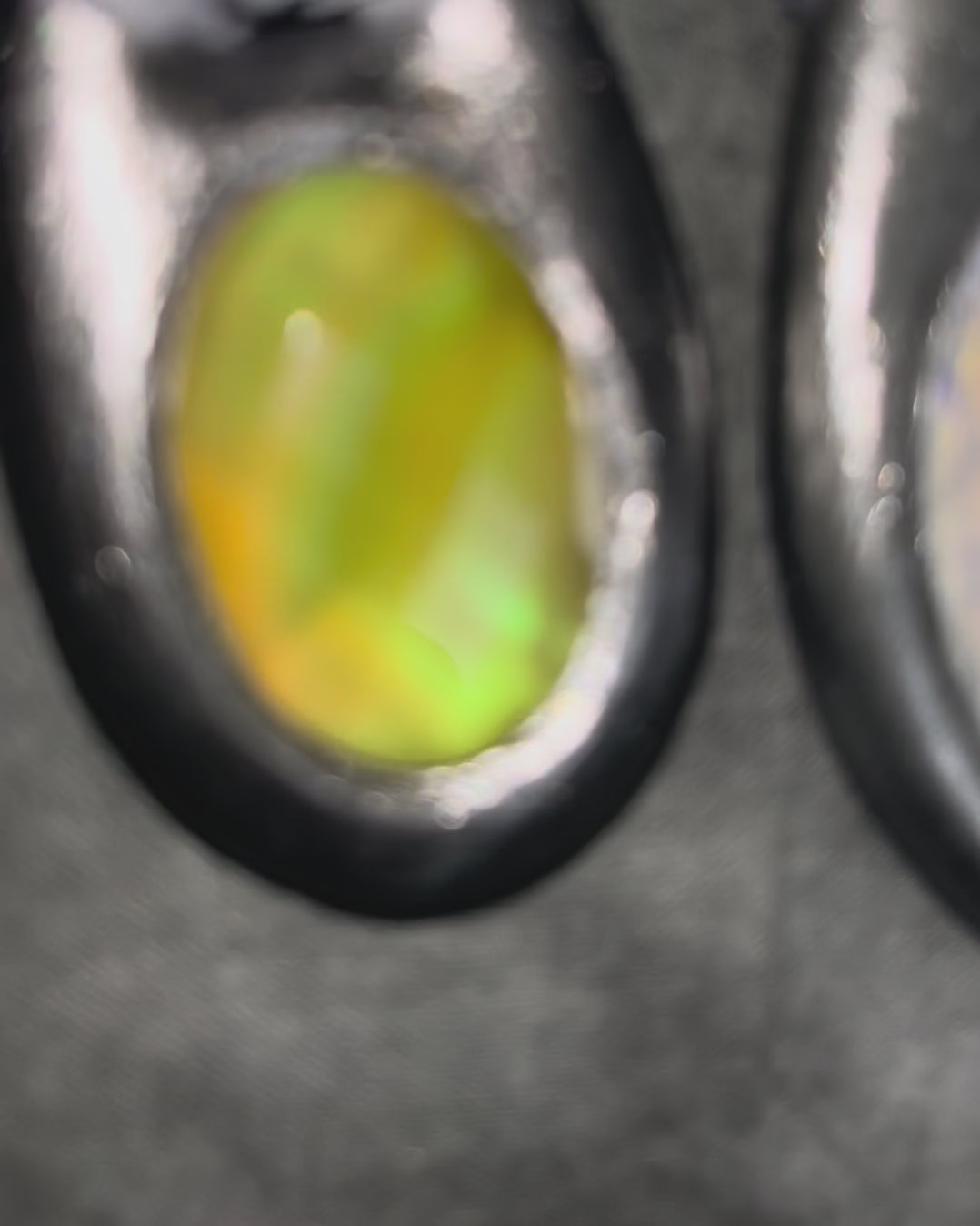 Handcrafted designer opalescent quartz gemstone crescent moon pendant in a silver finish with sustainable festival style recycled silks. 