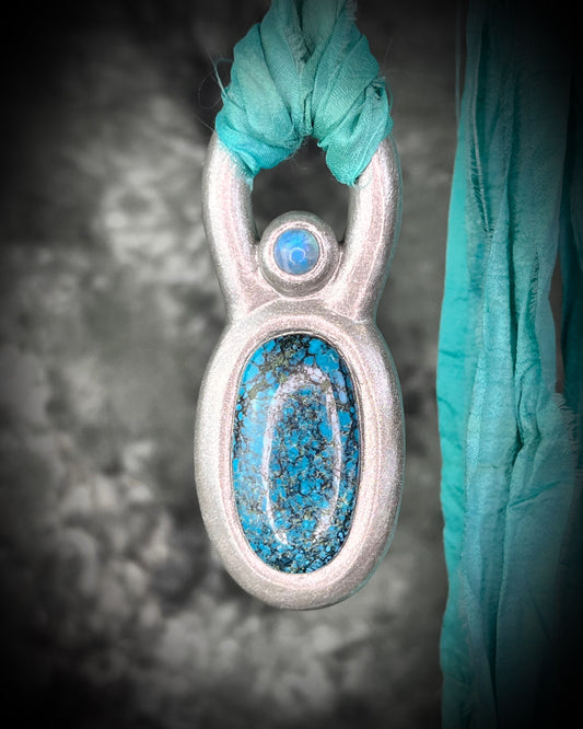 Handmade statement maximalist Turquoise and Moonstone chunky silver crystal jewelry on aqua recycled silk for a western  jewelry appeal.