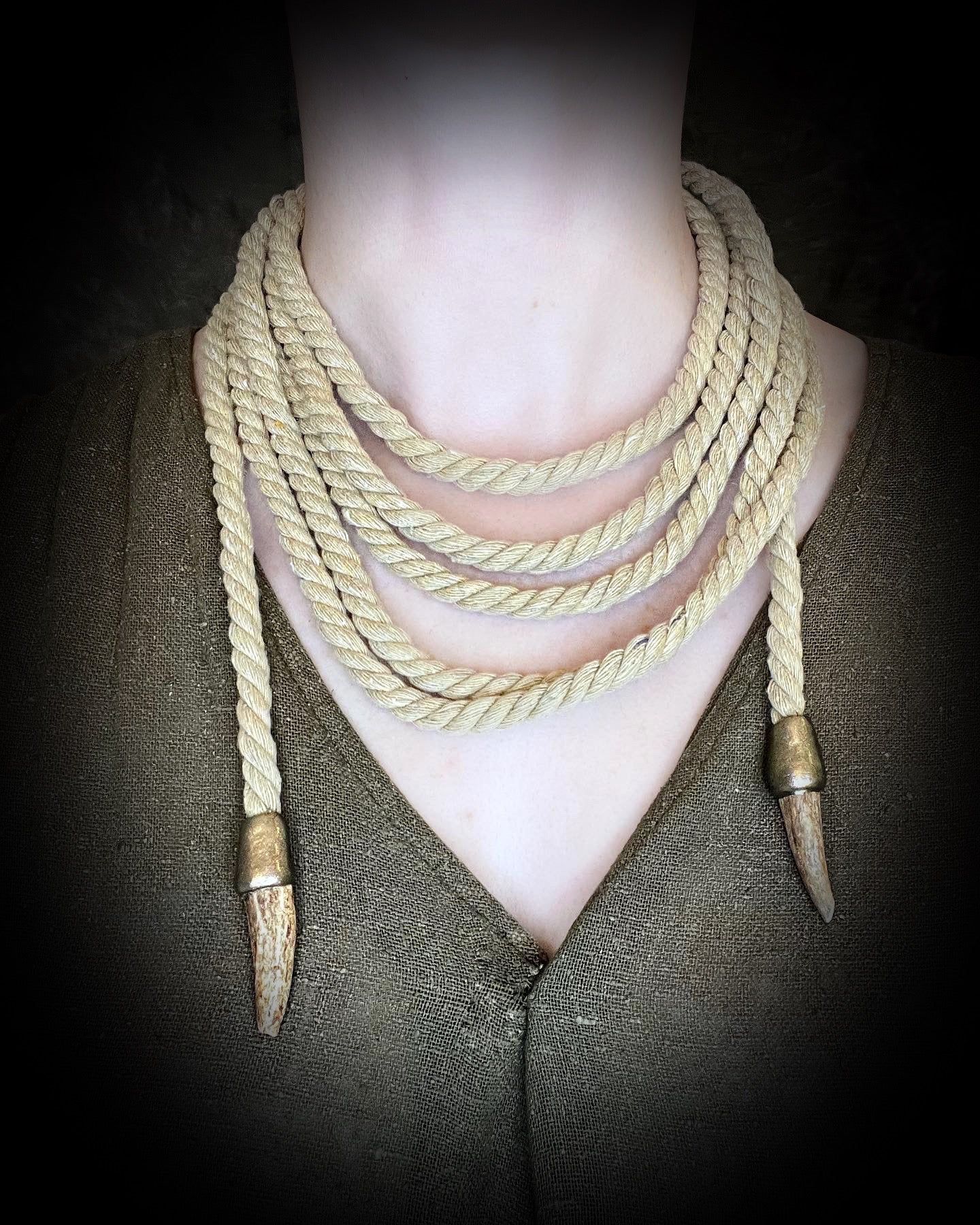 Versatile rope accessory for everyday, festival, cosplay or renaissance festival, adorned with two antler tips. Wear as a belt, necklace, hat band or head wrap, decoration, bondage rope or harness.